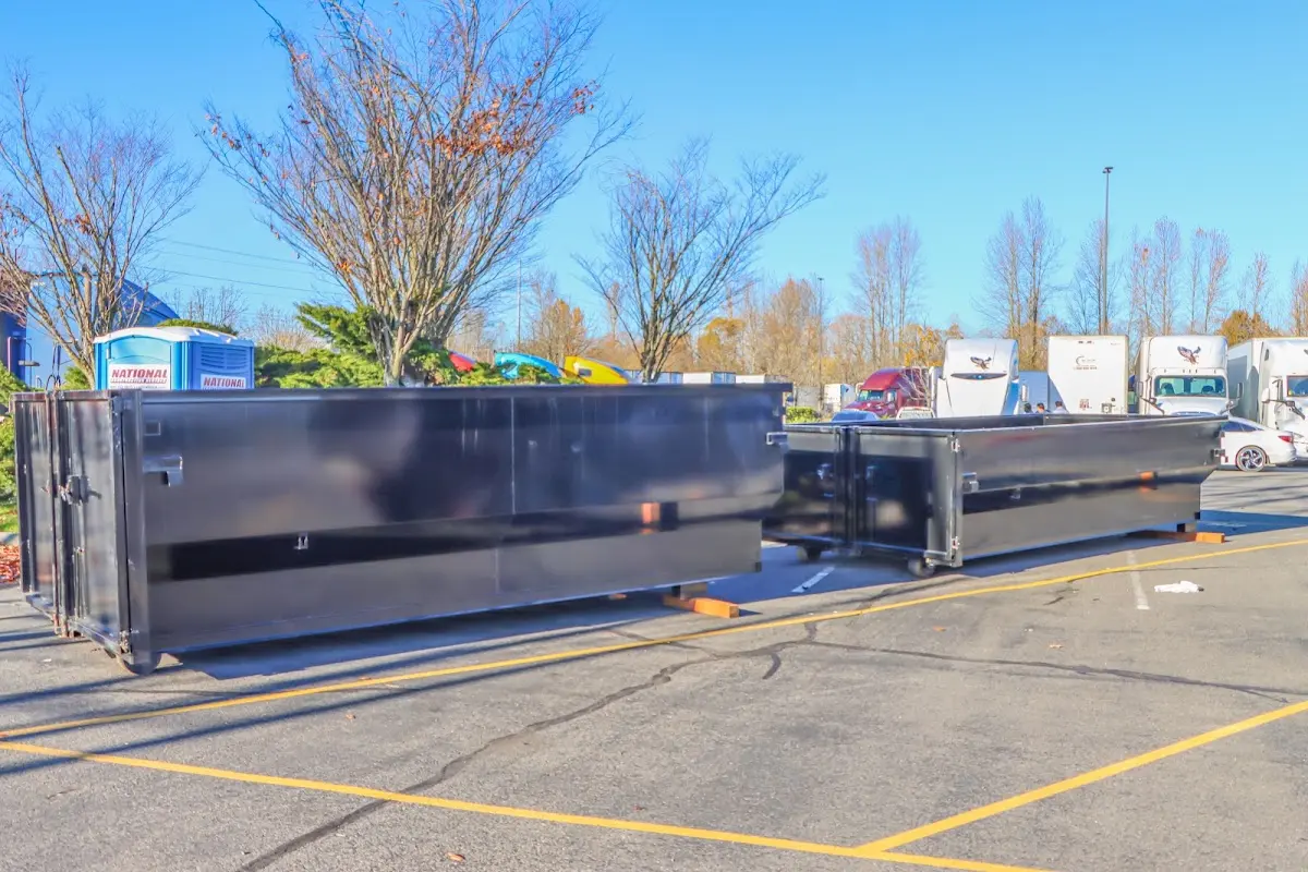 Professional dumpster rental service with roll-off container on residential driveway in Lincolnia